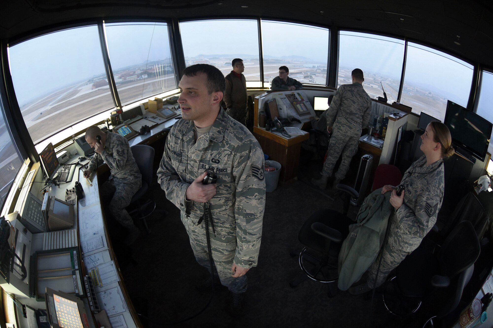 Air traffic control airmen perform operations in the airfield tower at Kunsan Air Base, Republic of Korea, Jan. 5, 2017. ATC ensures the safety of aircraft in the airspace around Kunsan. (U.S. Air Force photo by Senior Airman Michael Hunsaker/Released)