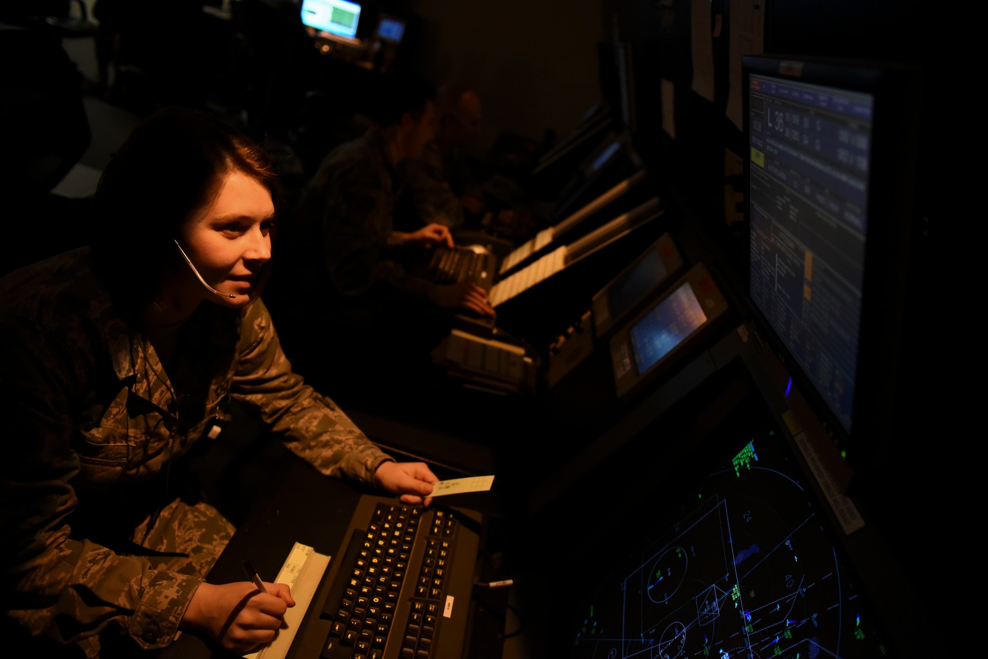 Senior Airman Justine King, 8th Operations Support Squadron air traffic controller, monitors the position of an aircraft on a radar screen at Kunsan Air Base, Republic of Korea, Jan. 5, 2017. Radar approach controllers are responsible for coordinating aircraft that fly within Kunsan’s airspace. (U.S. Air Force photo by Senior Airman Michael Hunsaker/Released)