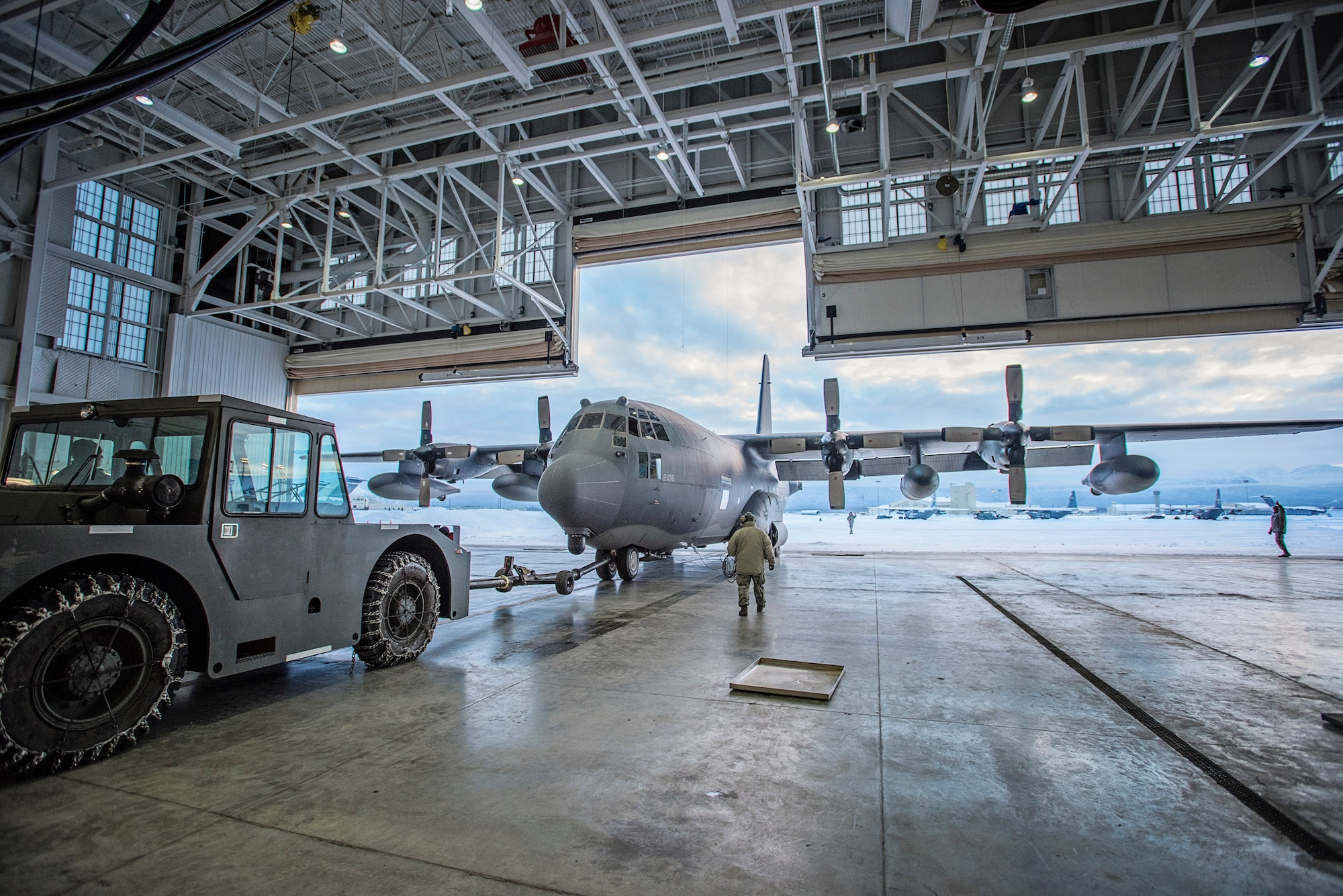 Current and former members of the 211th Rescue Squadron, Alaska Air National Guard, bid farewell to the last of their HC-130N aircraft (tail number 2106) Jan. 17 as it departed here for Patrick Air Force Base, Florida. The HC-130 variants of the C-130 family of aircraft are designed for long-range search-and-rescue missions. They are set up to provide command and control, airdrop of pararescue personnel and equipment, and perform air-refueling missions for helicopters like the HH-60 Pave Hawk helicopters flown by the 211th’s sister unit, the 210th Rescue Squadron. The older HC-130N’s are scheduled to be replaced with four new HC-130J “Combat King II” aircraft which are currently being manufactured at Lockheed Martin in Georgia. (U.S. Air National Guard photo by Staff Sgt. Edward Eagerton/released)