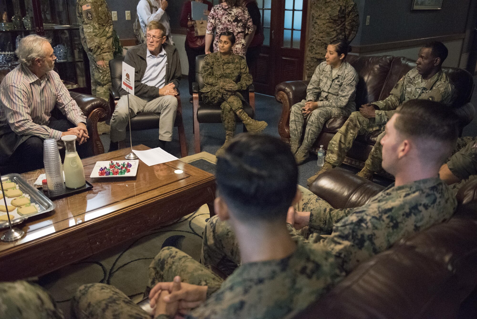 U.S. congressmen meet with U.S. service members during a meet-and-greet Dec. 20, 2016, at Kadena Air Base, Japan. The congressmen discussed quality of life and answered service members’ questions about their respective states. (U.S. Air Force photo by Senior Airman Omari Bernard/Released)