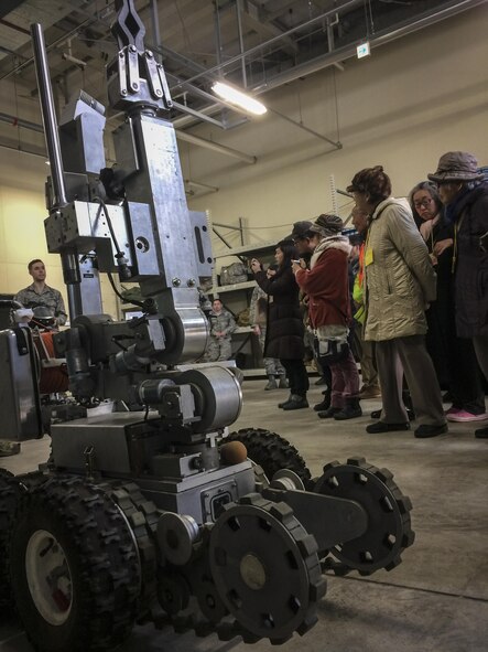 U.S. Air Force Airman 1st Class Christopher Waller, an explosive ordnance disposal apprentice with the 35th Civil Engineer Squadron, talks about the benefits associated with the unit’s bomb suit and robot with a group of Japanese nationals participating in a community relations tour at Misawa Air Base, Japan, Jan. 20, 2017. EOD Airmen are trained to detect, disarm, detonate and dispose of explosive threats all over the world. They are assigned some of the most dangerous missions and perform technically demanding tasks in diverse environments worldwide. (U.S. Air Force photo by Staff Sgt. Benjamin W. Stratton)
