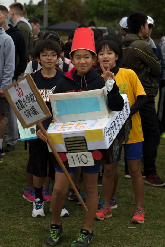 MARINE CORPS AIR STATION FUTENMA, OKINAWA, Japan – A local resident poses Jan. 21 prior to the Ginowan City Traffic Safety Relay Race at MCAS Futenma. Participants followed crosswalk and traffic signals during the 14-kilometer race in an effort to raise awareness for traffic safety. Thirty-seven teams in total participated in the event including Marines and sailors. 