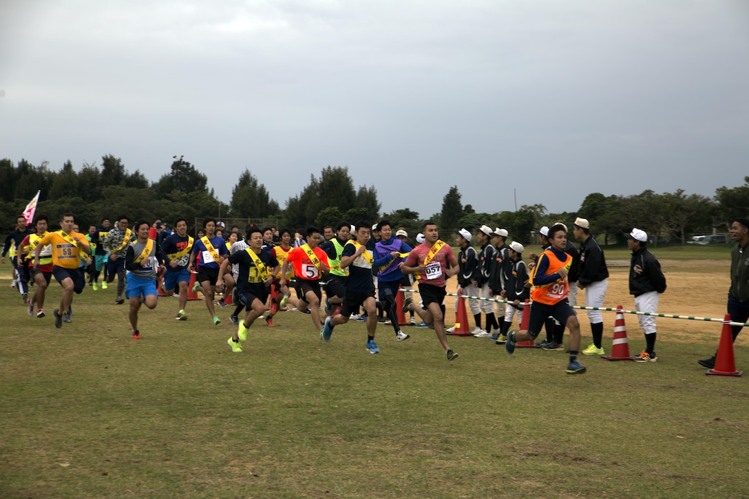 MARINE CORPS AIR STATION FUTENMA, OKINAWA, Japan – Runners take off Jan. 21 at the start of the Ginowan City Traffic Safety Relay Race at Marine Corps Air Station Futenma. Participants of the 14-kilometer race obeyed all crosswalk and traffic signals in an effort to raise awareness about traffic safety. Events like this get Marines out in to the community and strengthen the U.S-Japan alliance.