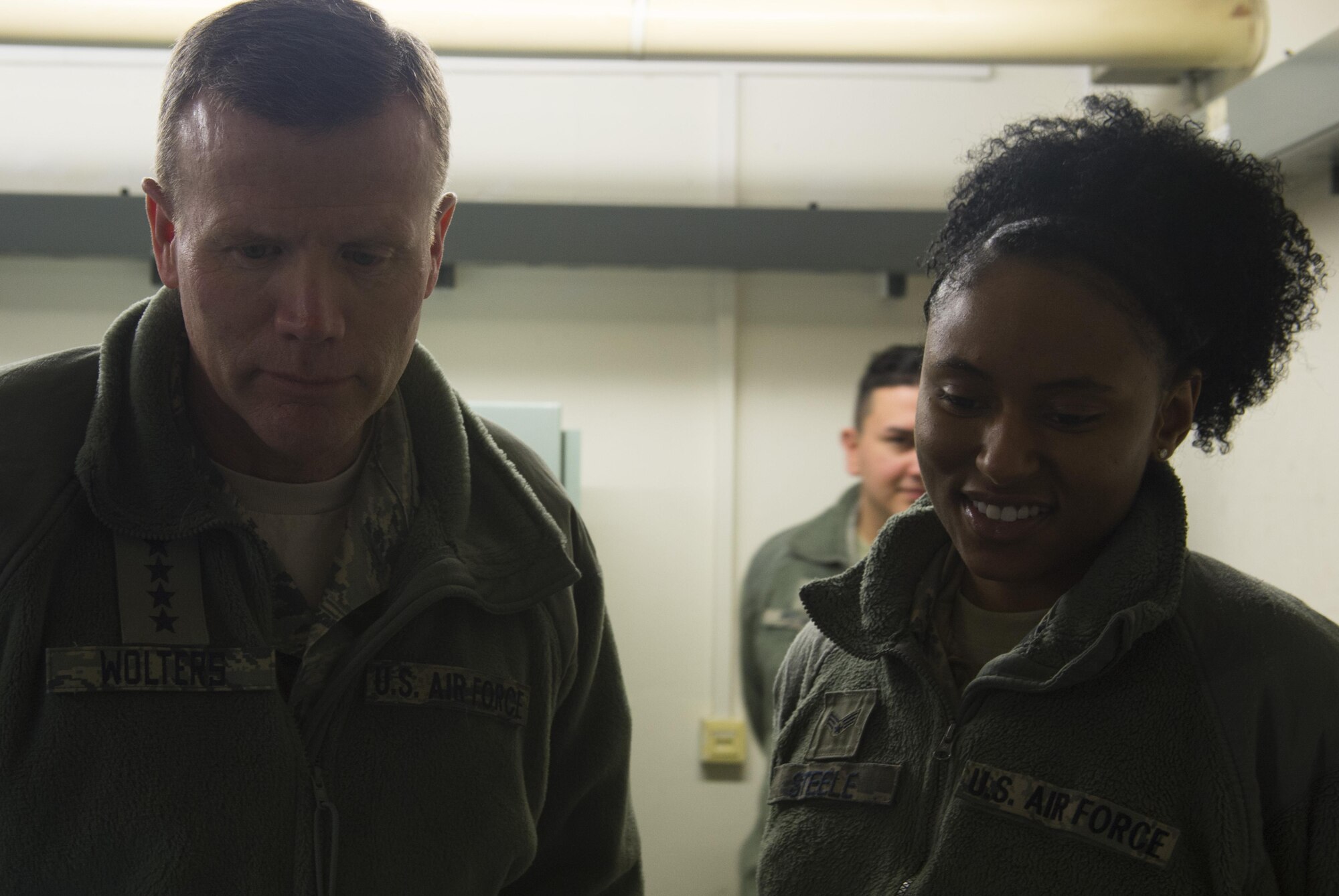 U.S. Air Force Gen. Tod Wolters, U.S. Air Forces in Europe and Air Forces Africa commander, listens to a briefing from Senior Airman Tajalyn Steele, 702nd Munitions Support Squadron radio frequency transmissions operator, at Buechel Air Base, Germany, Jan. 19, 2017. The 702nd MUNSS is divided into five flights consisting of the maintenance, operations, communications, custody and force support. The squadron directly supports NATO contingency and wartime operations and its strike mission. (U.S. Air Force Photo/Senior Airman Dawn M. Weber)