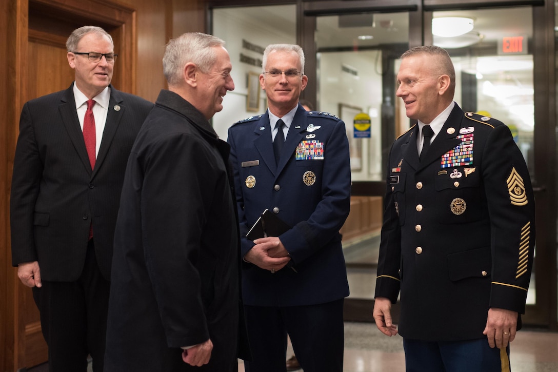 Defense Secretary Jim Mattis, second from left, meets Army Command Sgt. Maj. John W. Troxell, right, senior enlisted advisor to the chairman of the Joint Chiefs of Staff, at the Pentagon during his first full day as secretary, Jan. 21, 2017. Looking on are Deputy Defense Secretary Bob Work, left, and Air Force Gen. Paul Selva, vice chairman of the Joint Chiefs of Staff. DoD photo by D. Myles Cullen