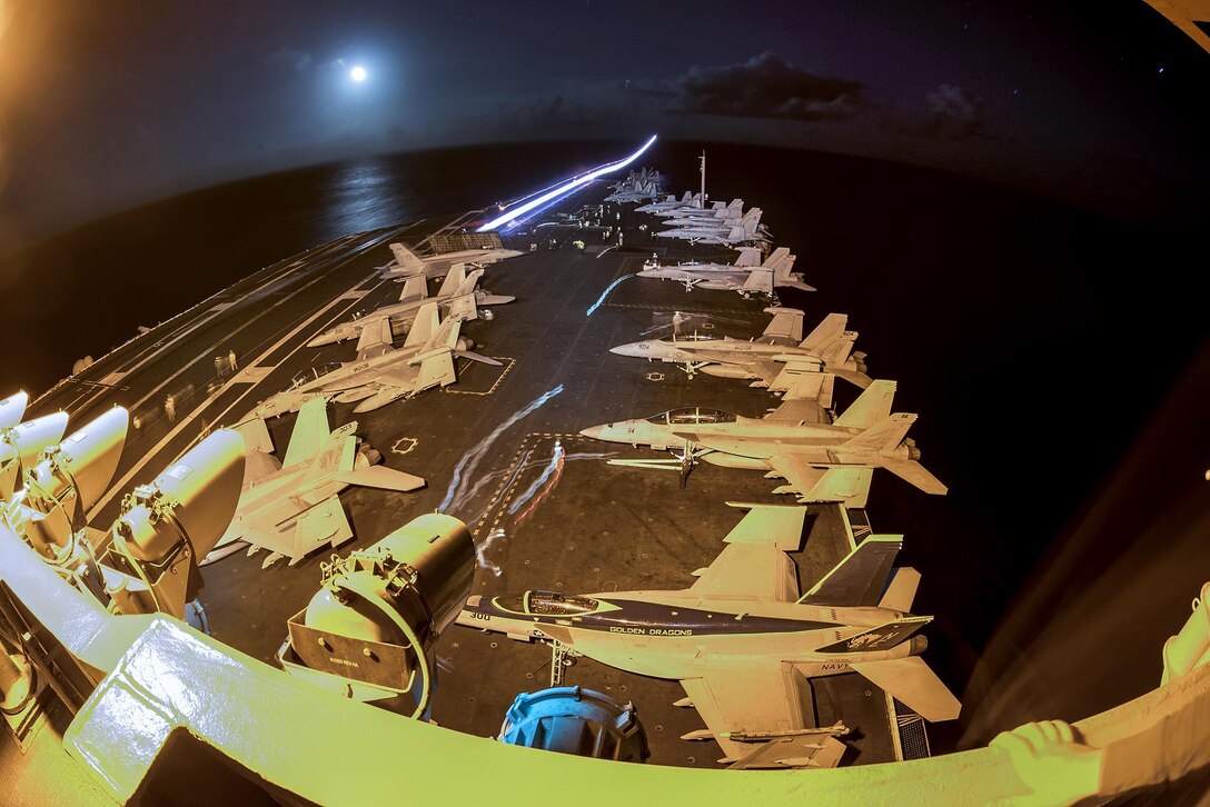 An F/A-18F Super Hornet aircraft launches from the flight deck aboard the aircraft carrier USS Carl Vinson in the Pacific Ocean, Jan. 14, 2017. Navy photo by Petty Officer 2nd Class Sean M. Castellano