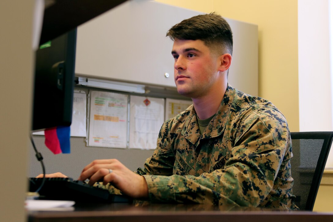 Cpl. Jimmy Moretz logs Marines’ training information into his computer aboard Marine Corps Air Station Cherry Point, N.C., Jan. 17, 2017. Moretz is the emergency dispatcher assigned to Marine Air Support Squadron 1, Marine Air Control Group 28, 2nd Marine Aircraft Wing, and training noncommissioned officer for his platoon in the motor and transport section of the squadron. Moretz has been recognized as the noncommissioned officer of the quarter for the period of Oct. 1, 2016 to Dec. 31, 2016 for his outstanding work in his squadron. (U.S. Marine Corps photo by Cpl. Jason Jimenez/ Released)