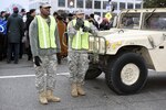 Spc. Shaleek Blackman, left, with the Delaware Army National Guard’s 153rd Military Police Company, and Army Staff Sgt. Eric Stunkard, with the Delaware Army Guard’s 262nd Component Repair Company, keep an eye out as crowds make their way to the National Mall for the 58th Presidential Inauguration in Washington, D.C., Jan. 20, 2017. The Soldiers were among more than 7,500 National Guard members from 44 states, territories and the District of Columbia, who supported local authorities during the inauguration. 