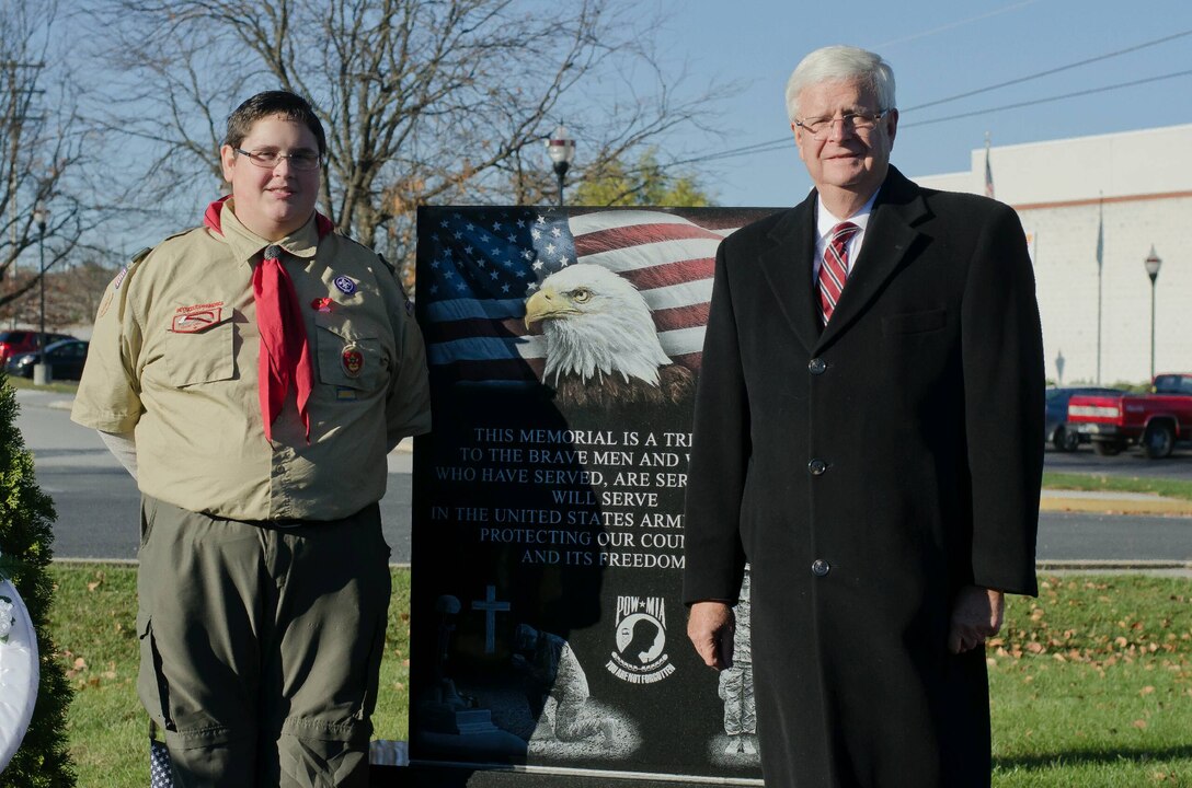Travis Hartlaub stands with retired Navy Vice Adm. Keith Lippert in front of his completed veteran’s memorial Eagle Scout project at the Littlestown Community Park.