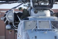 U.S. Marine Corps Gunnery Sgt. Christopher A. Harrison, an airframes mechanic assigned to Marine Heavy Helicopter Squadron 464, conducts a service and leakage check on a CH-53E Super Stallion during a cold weather training exercise in Brunswick, Maine, Jan. 20. 2017. HMH-464 conducted the exercise to increase the squadron’s operational readiness in extreme conditions.