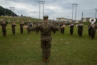 U.S. Marine Corps MSgt. Michael Stanley conducts the III Marine Expeditionary Force band during a change of command ceremony for 3rd Marine Division as Maj. Gen. Richard L. Simcock II relinquishes command to Maj. Gen. Craig Q. Timberlake on Camp Courtney, Okinawa, Japan, Jan. 20, 2017. The change of command ceremony formally transferred authorities and responsibilities for 3rd Marine Division from one commander to another and is a long-standing Marine Corps tradition.