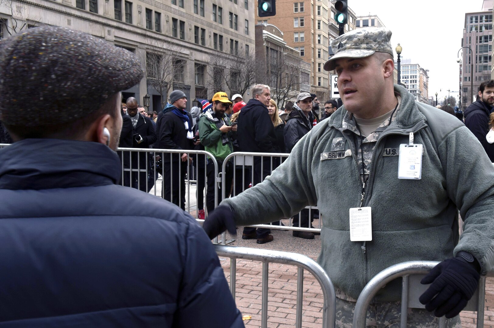 Army Sgt. Kurtis Brown, a military police officer with the South Dakota Army National Guard’s 235th Military Police Company, answers questions from a spectator near a checkpoint in Washington, D.C., during the 58th Presidential Inauguration, Jan. 20, 2017. Brown was one of more than 7,500 National Guard members from 44 states, territories and the District of Columbia, who supported local authorities during the inauguration. 