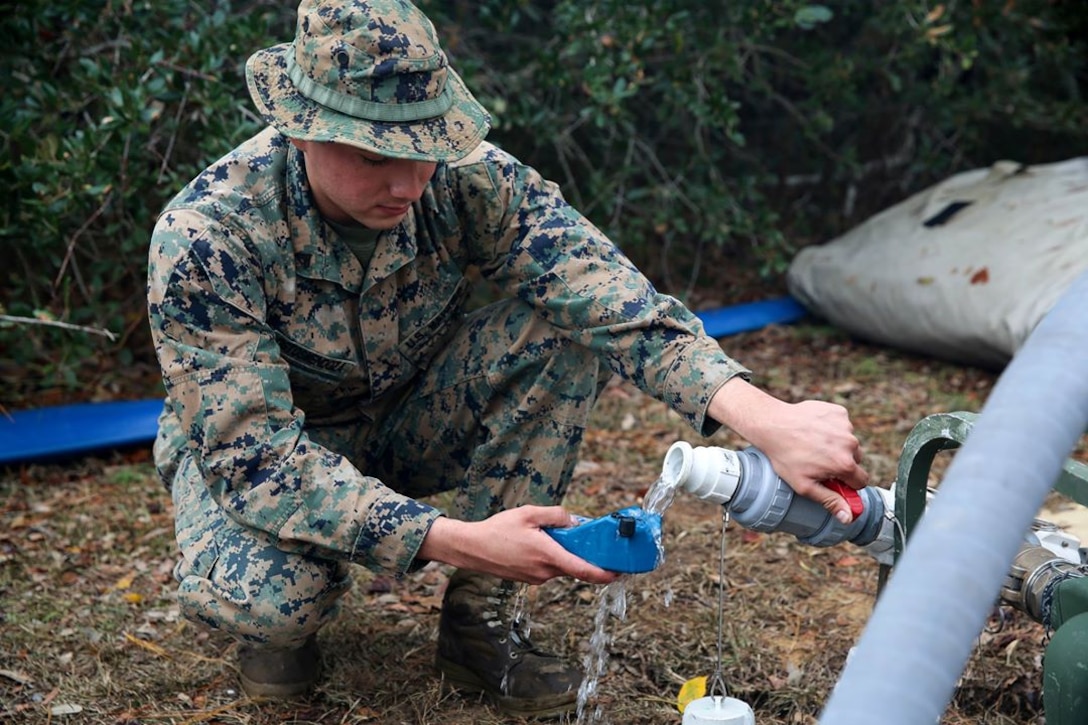 Cpl. Abraham Ostosmendoza tests water during a field exercise aboard Marine Corps Auxiliary Landing Field Bogue, Dec. 6, 2016. Ostosmendoza is a water support technician assigned to Marine Wing Support Squadron 271, Marine Aircraft Group 14, 2nd Marine Aircraft Wing.