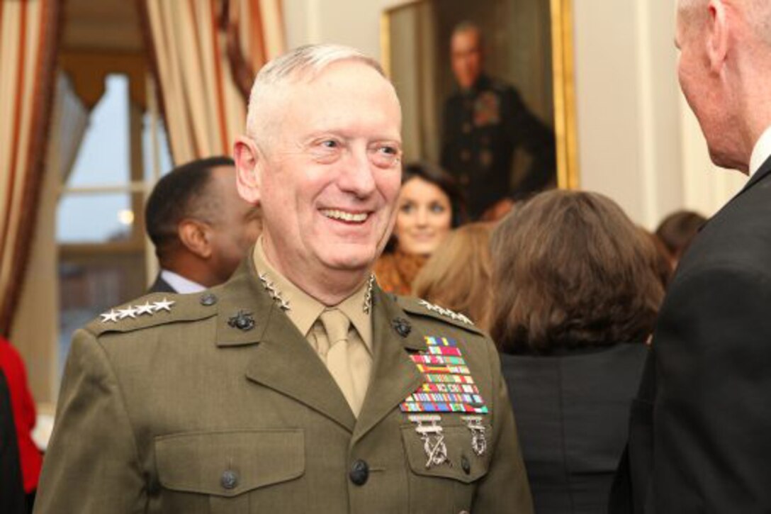 Marine Corps Gen. Jim Mattis speaks with guests during a joint retirement reception for him and Gen. John R. Allen at the Home of the Commandants in Washington, Apr. 4, 2013. Marine Corps photo by Cpl. Tia Dufour