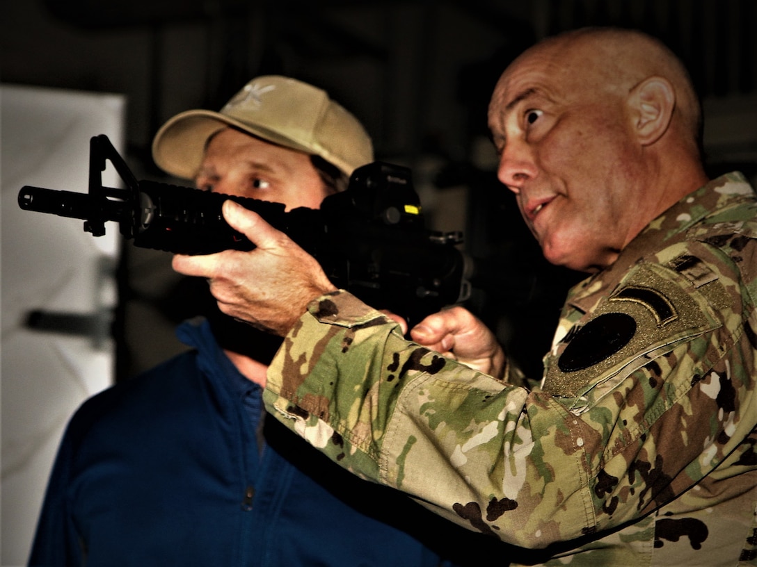 VICENZA, Italy-Commanding General LTG Charles D. Luckey, U.S. Army Reserve Command demonstrates how to fire a rifle during a visit to  7th Mission Support Command Soldiers from the 2500th Digital Liaison Detachment and Company A, 457th Civil Affairs Battalion, Jan. 21, 2017. 
