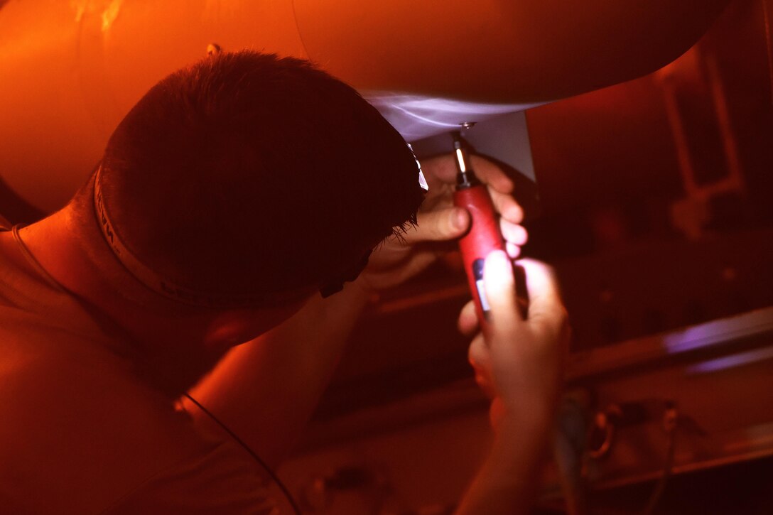 Air Force Staff Sgt. Brody Bundy secures panels on a GBU-12 Paveway II bomb before it is loaded onto an F-35A Lightning II aircraft at Eglin Air Force Base, Fla., Jan. 18, 2017. Bundy is an aircraft armament systems craftsman assigned to the 33rd Aircraft Maintenance Squadron. Air Force photo by Staff Sgt. Peter Thompson