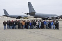 Members of the 564th Aircraft Maintenance Squadron Block 45 avionics modification team pose on the flight line near two KC-135Rs undergoing upgrade Dec. 15, 2016, Tinker Air Force Base, Oklahoma. Four spots on the south ramp are designated exclusively for the Block 45 upgrade. (U.S. Air Force photo/Greg L. Davis)
