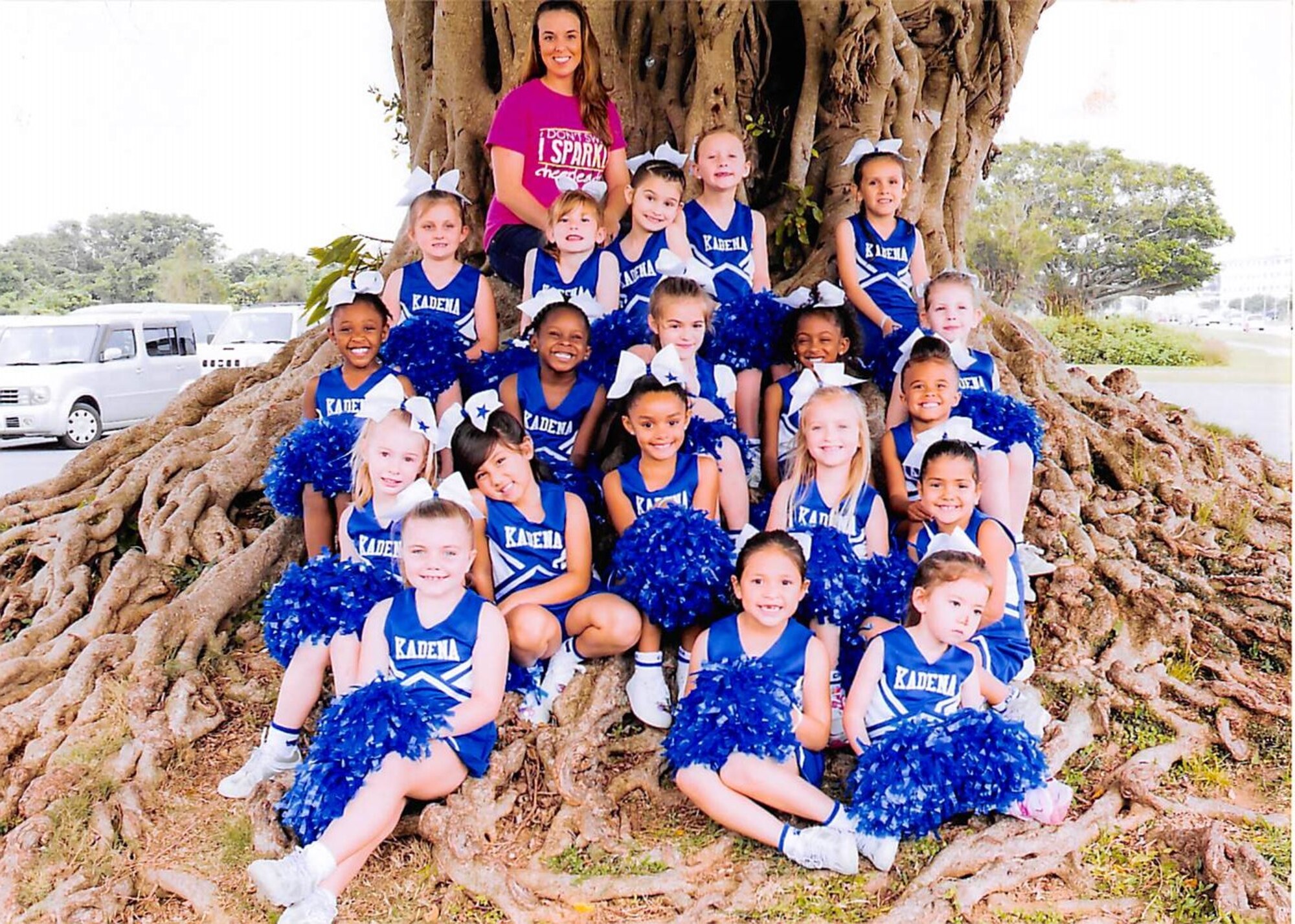 Staff Sgt. Angela Wilkerson, 22nd Air Refueling Wing command chief executive assistant, poses with the cheerleaders she coached, May 2015, at Kadena Air Base, Japan. Wilkerson has made cheerleading a large part of her life since she was 4 years old and is starting McConnell’s first cheer program in March. (Courtesy photo)