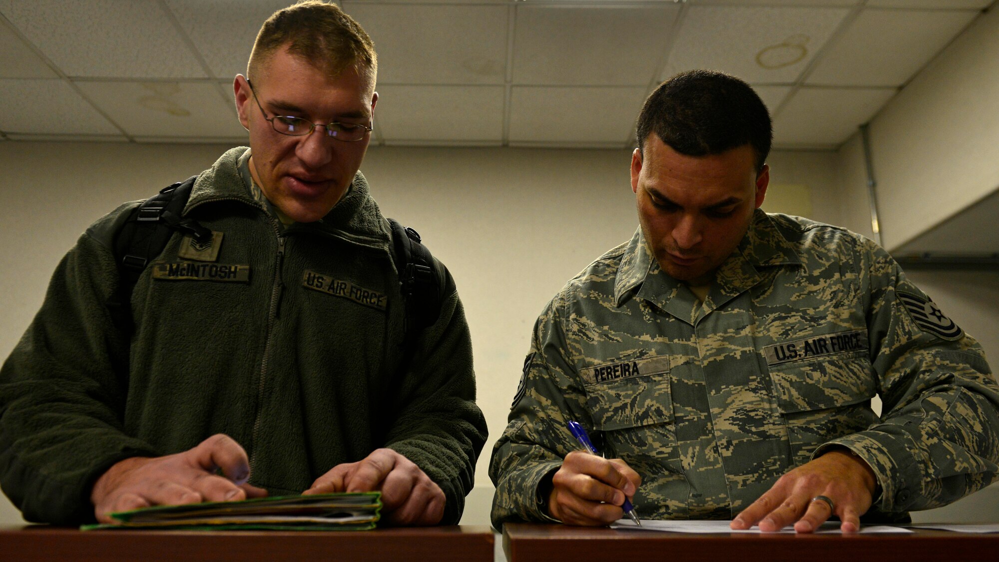 An Airman from the 31st Fighter Wing processes through the personnel deployment function line at Aviano Air Base, Italy on Jan. 21, 2017. The Airmen traveled to Souda Bay, Greece, to support a flying training deployment with the Hellenic air force. (U.S. Air Force photo by Senior Airman Cary Smith)