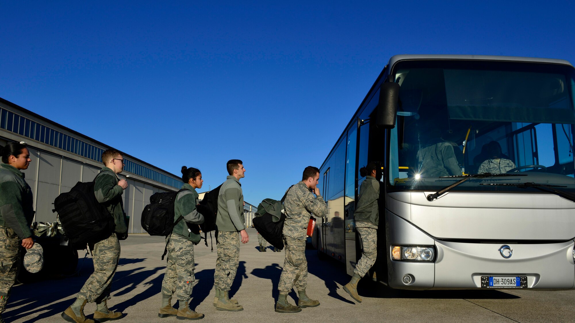 Airmen from the 31st Fighter Wing board a bus at Aviano Air Base, Italy on Jan. 21, 2017. The Airmen flew on a C-130 Hercules to Souda Bay, Greece to support a flying training detachment with the Hellenic air force. (U.S. Air Force photo by Senior Airman Cary Smith)