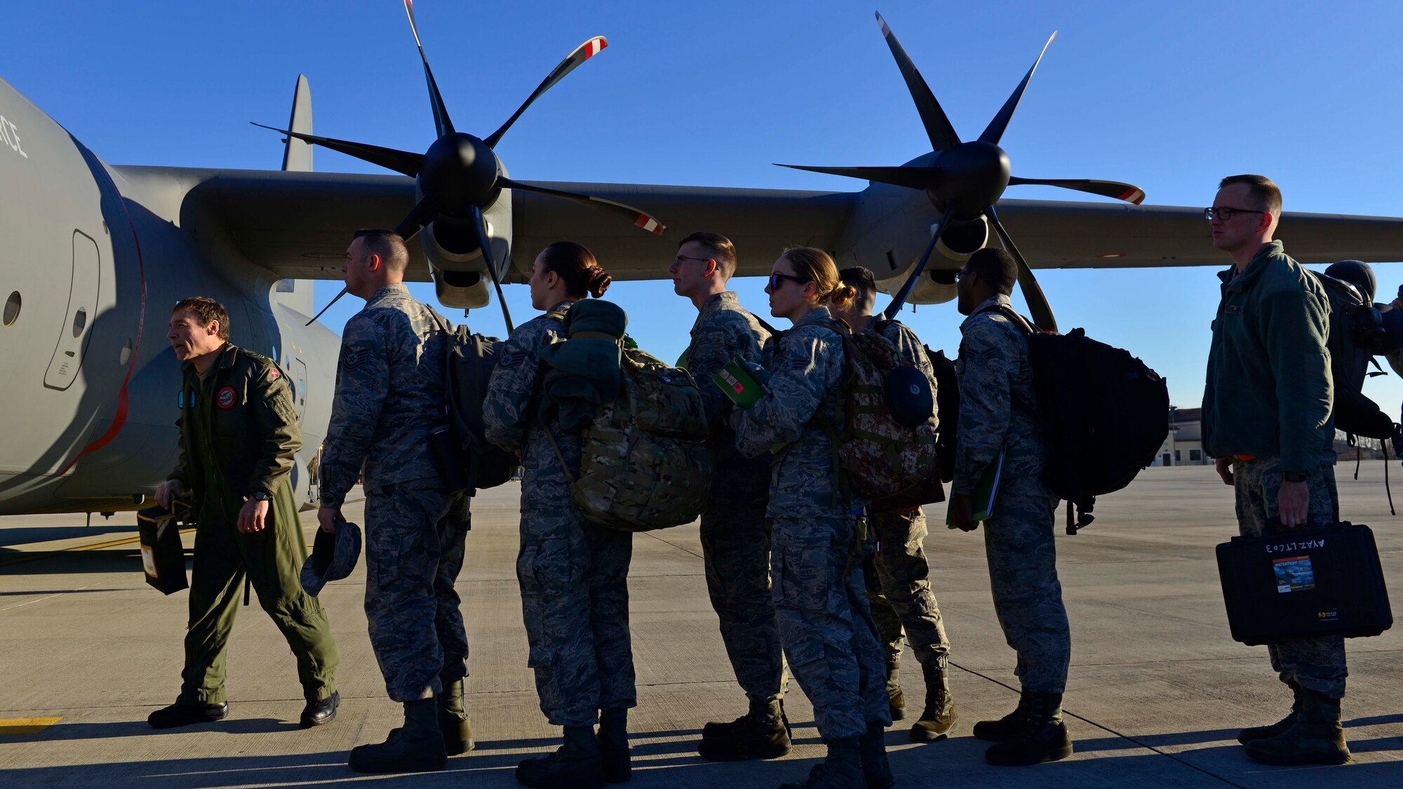 Airmen from the 31st Fighter Wing wait to board a C-130 Hercules at Aviano Air Base, Italy on Jan. 21, 2017. The Airmen traveled to Souda Bay, Greece, to support a flying training detachment with the Hellenic air force. (U.S. Air Force photo by Senior Airman Cary Smith)