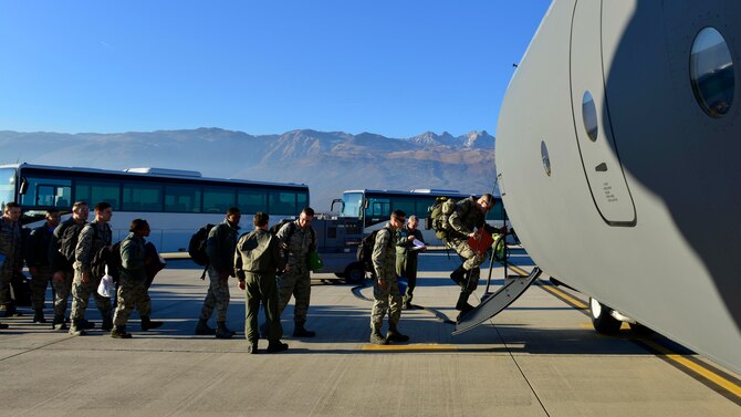 Airmen from the 31st Fighter Wing board a C-130 Hercules at Aviano Air Base, Italy, Jan. 21, 2017, on their way to Souda Bay, Greece. The Airmen traveled to Souda Bay to support a flying training deployment with the Hellenic Air Force. (U.S. Air Force photo/Senior Airman Cary Smith)