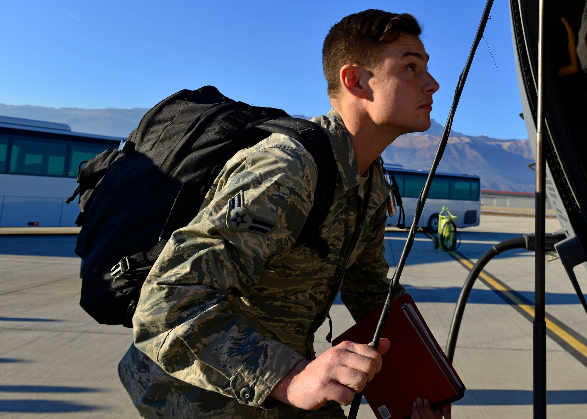 An Airman from the 31st Fighter Wing boards a C-130 Hercules at Aviano Air Base, Italy on Jan. 21, 2017 on their way to Souda Bay, Greece. The Airmen traveled to Souda Bay, Greece, to support a flying training detachment with the Hellenic air force. (U.S. Air Force photo by Senior Airman Cary Smith)