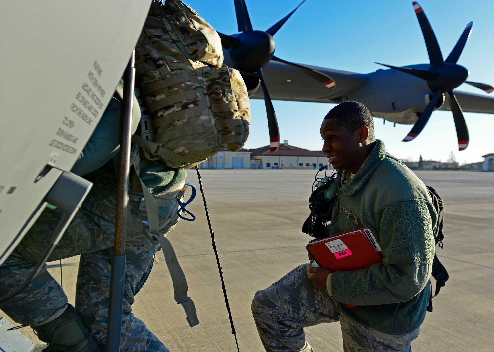 An Airman from the 31st Fighter Wing boards a C-130 Hercules at Aviano Air Base, Italy on Jan. 21, 2017 on their way to Souda Bay, Greece. Approximately 300 personnel from the 31st Fighter Wing and Arizona Air National Guard’s 161st Air Refueling Wing traveled to Greece for a flying training deployment with the Hellenic air force. (U.S. Air Force photo by Senior Airman Cary Smith)