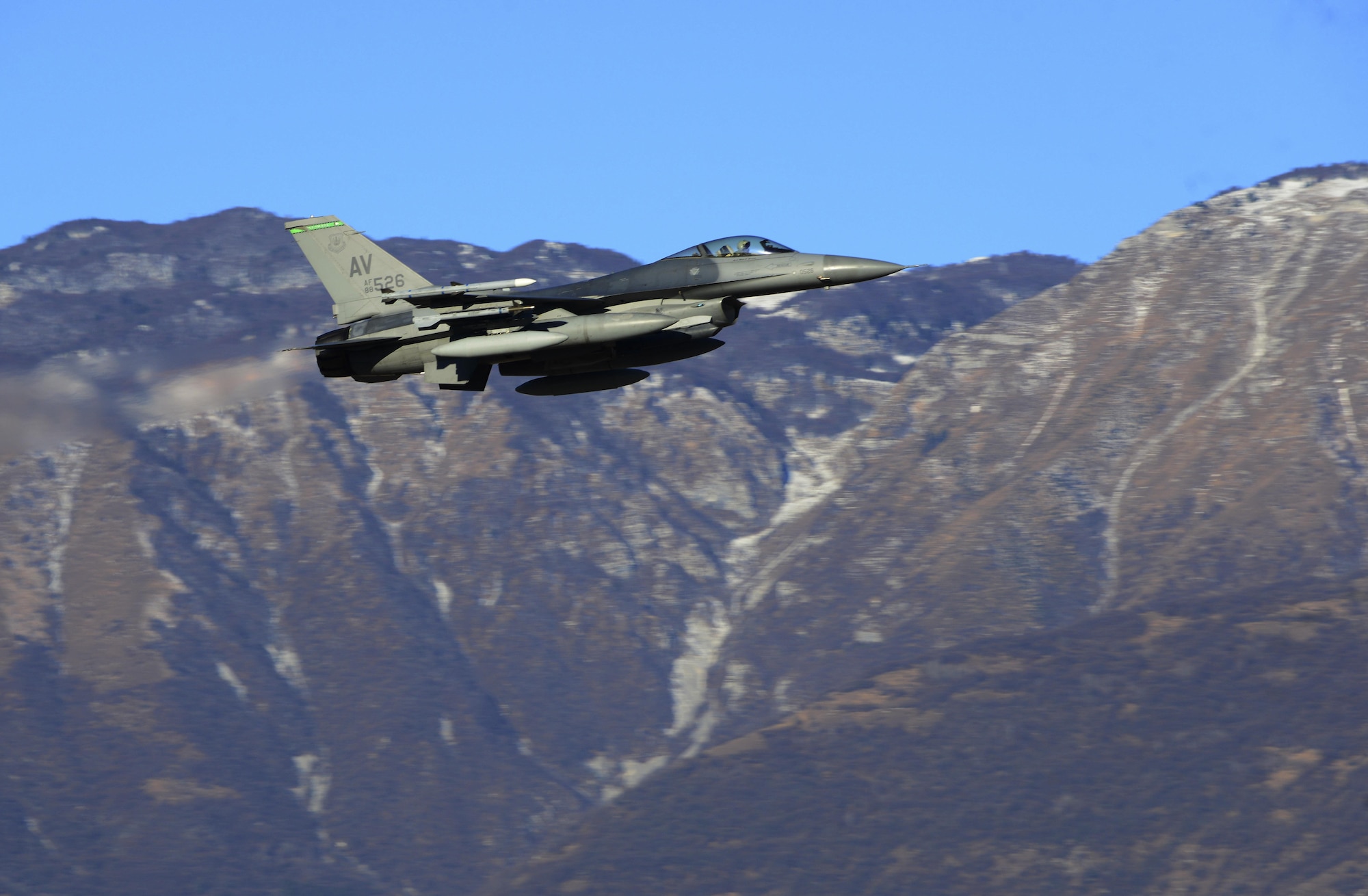 A 555th Fighter Squadron F-16 Fighting Falcon departs from Aviano Air Base, Italy on Jan. 21, 2016 to support a flying training deployment in Souda Bay, Greece. Fourteen F-16s, one KC-135 Stratotanker from the Arizona Air National Guard’s 161st Air Refueling Wing, and 280 Airmen deployed to Souda Bay to train with Greece’s Hellenic air force. (U.S. Air Force photo by Staff Sgt. Krystal Ardrey)