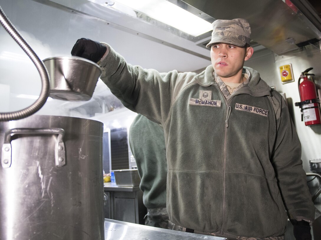 U.S. Air Force Master Sgt. Patrick McMahon, from the 116th Air Control Wing (ACW) Services Flight, Georgia Air National Guard (ANG), removes hot water from a pot while preparing dinner for joint-forces personnel supporting the 58th Presidential Inauguration, Washington, D.C., January 19, 2017. A team of 10 Airmen from the 116th ACW deployed with their Disaster Relief Mobile Kitchen Trailer, or DRMKT.  Working from FedEx Field, home to the Washington Redskins, the team worked along side services teams from other ANG units across the nation preparing and serving meals to about 3,500 joint-force members per day deployed to the National Capital Region. In all, about 7,500 National Guard Soldiers and Airmen, from 44 states, three territories and the District of Columbia, served with the specially created Joint Task Force – District of Columbia. As a whole, National Guard Soldiers and Airmen augmented the U.S. Secret Service, U.S. Capitol Police and D.C. Metropolitan Police forces on a range of support including traffic control, crowd management, logistics and communication. (U.S. Air National Guard photo by Senior Master Sgt. Roger Parsons)