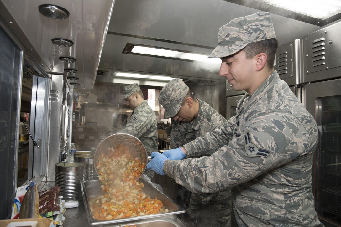 U.S. Air Force Airman 1st Class Alexander O’Reilly, from the 116th Air Control Wing (ACW) Services Flight, Georgia Air National Guard (ANG), prepares vegetables for dinner for joint-forces personnel supporting the 58th Presidential Inauguration, Washington, D.C., January 19, 2017. A team of 10 Airmen from the 116th ACW deployed with their Disaster Relief Mobile Kitchen Trailer, or DRMKT. Working from FedEx Field, home to the Washington Redskins, the team worked along side services teams from other ANG units across the nation preparing and serving meals to about 3,500 joint-force members per day deployed to the National Capital Region. In all, about 7,500 National Guard Soldiers and Airmen, from 44 states, three territories and the District of Columbia, served with the specially created Joint Task Force – District of Columbia. As a whole, National Guard Soldiers and Airmen augmented the U.S. Secret Service, U.S. Capitol Police and D.C. Metropolitan Police forces on a range of support including traffic control, crowd management, logistics and communication. (U.S. Air National Guard photo by Senior Master Sgt. Roger Parsons)