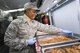 U.S. Air Force Airman 1st Class Dasmon Henley from the 116th Air Control Wing (ACW) Services Flight, Georgia Air National Guard (ANG), prepares a tray of spaghetti during dinner preparation for joint-forces personnel supporting the 58th Presidential Inauguration, Washington, D.C., January 18, 2017. A team of 10 Airmen from the 116th ACW deployed with their Disaster Relief Mobile Kitchen Trailer (DRMKT).  Working from FedEx Field, home to the Washington Redskins, the team worked along side services teams from other ANG units across the nation preparing and serving meals to about 3,500 joint-force members per day deployed to the National Capital Region. In all, about 7,500 National Guard Soldiers and Airmen, from 44 states, three territories and the District of Columbia, served with the specially created Joint Task Force – District of Columbia. As a whole, National Guard Soldiers and Airmen augmented the U.S. Secret Service, U.S. Capitol Police and D.C. Metropolitan Police forces on a range of support including traffic control, crowd management, logistics and communication. (U.S. Air National Guard photo by Senior Master Sgt. Roger Parsons)
