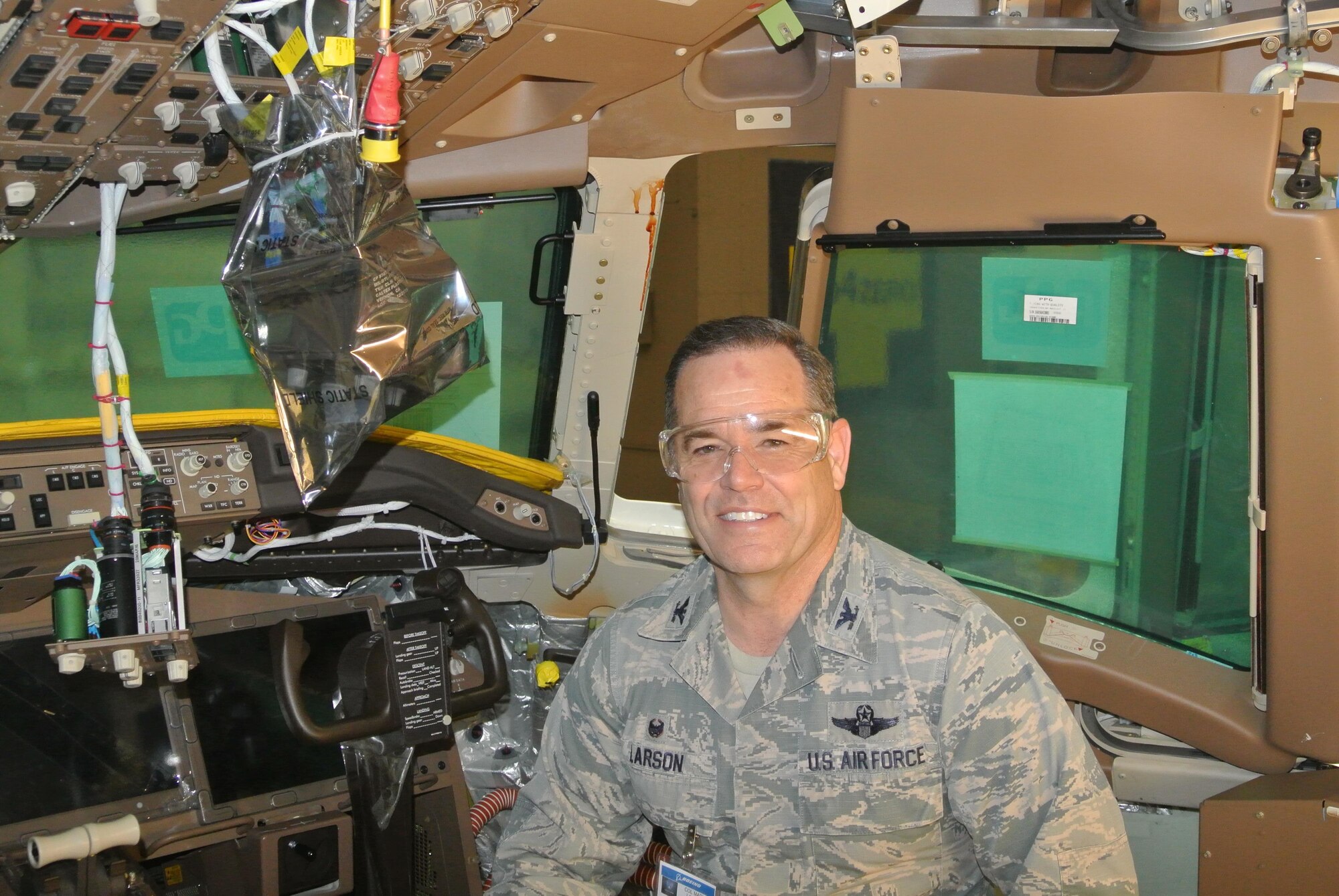Col. Mark S. Larson poses with a future "member" of Team McConnell, Jan. 19, 2017,  at the Boeing Facility located in Everett, Wash. The KC-46A Pegasus is the first of the next-generation tankers scheduled to be delivered to the base later this year. The new aircraft will eventually replace the Air Force’s aging KC-135 Stratotanker fleet. (Courtesy photo)