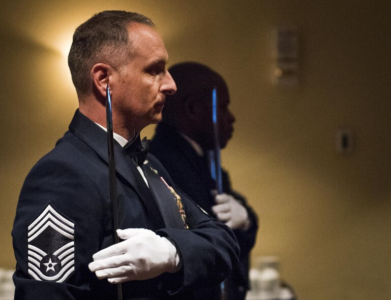 Chief master sergeants bring their sabers to rest at their shoulder during a recognition ceremony Jan. 20 at Eglin Air Force Base, Fla.  Six new chiefs were recognized during the formal ceremony and dinner.  (U.S. Air Force photo/Samuel King Jr.)