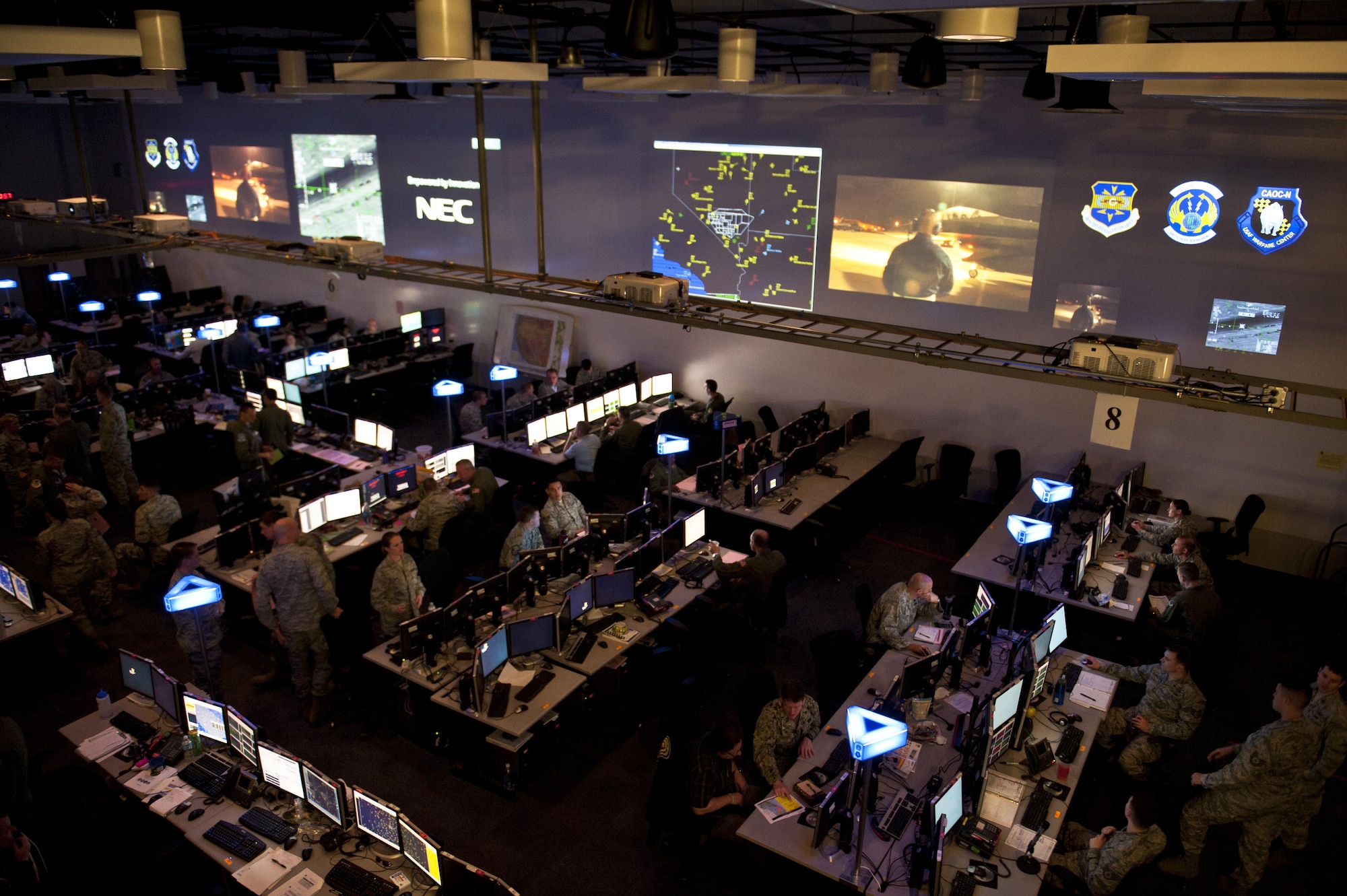 Airmen participate in the live, virtual, constructive portion of Red Flag 15-2 at the Combined Operations Center-Nellis on Nellis Air Force Base, Nev., March 5, 2015. Red Flag 15-2 will be the first Red Flag exercise that will include hundreds of virtual and constructive participants in simulators at their home stations or the Distributed Mission Operations Center at Kirtland Air Force Base, N.M. (U.S. Air Force photo by Senior Airman Thomas Spangler) 