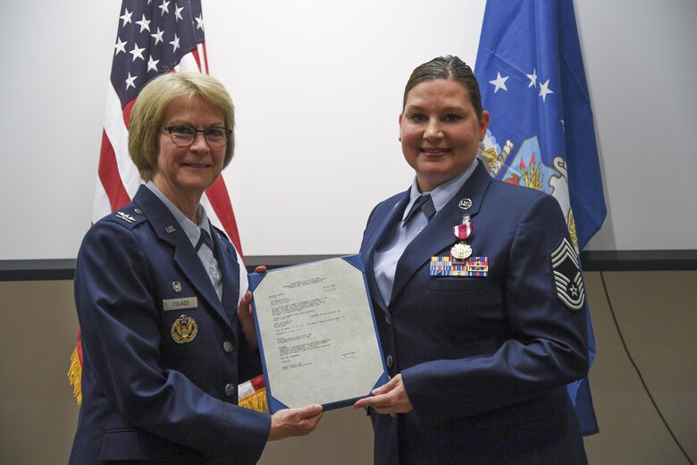 Chief Master Sgt. Misty Monroe, 911th Aeromedical Staging Squadron Superintendent, receives her retirement order at the Pittsburgh International Airport Air Reserve Station, Pa, January 7, 2017. Monroe, an Ohio native, joined the Air Force in 1995 and has served in many different medical roles over her career. (U.S. Air Force photo by Senior Airman Beth Kobily)