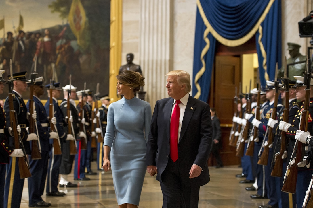 President Donald J. Trump and First Lady Melania Trump walk through a joint  forces honor cordon in the U.S. Capitol during the 58th presidential inauguration in Washington, D.C., Jan. 20, 2017. More than 5,000 service members from all branches of the military provided support during inaugural events. DoD photo by Air Force Staff Sgt. Marianique Santos