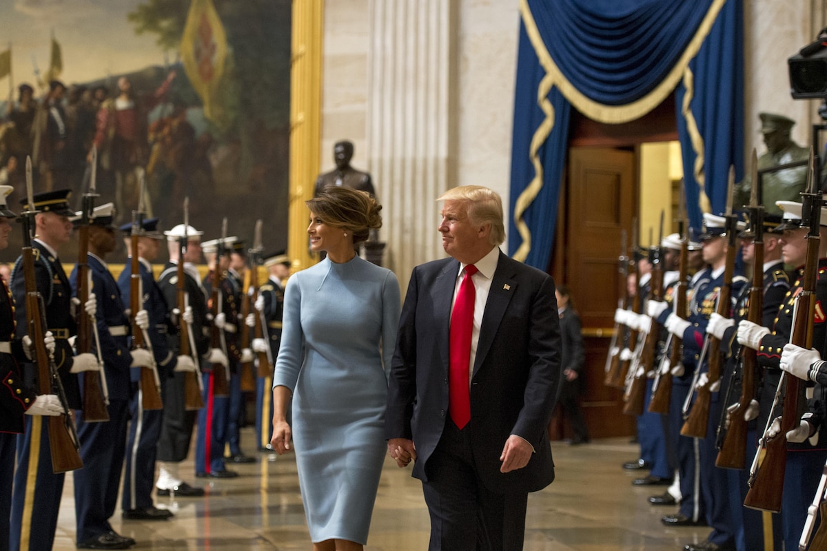 President Donald J. Trump and First Lady Melania Trump walk through an honor cordon.