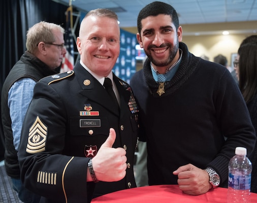 Army Command Sgt. Maj. John W. Troxell, senior enlisted advisor to the chairman of the Joint Chiefs of Staff, and Medal of Honor recipient Florent Groberg pose for a photo during the Medal of Honor Foundation reception prior to the 2016 Military Bowl at Navy-Marine Corps Memorial Stadium in Annapolis, Md., Dec. 27, 2016. DoD photo by Army Sgt. James K. McCann