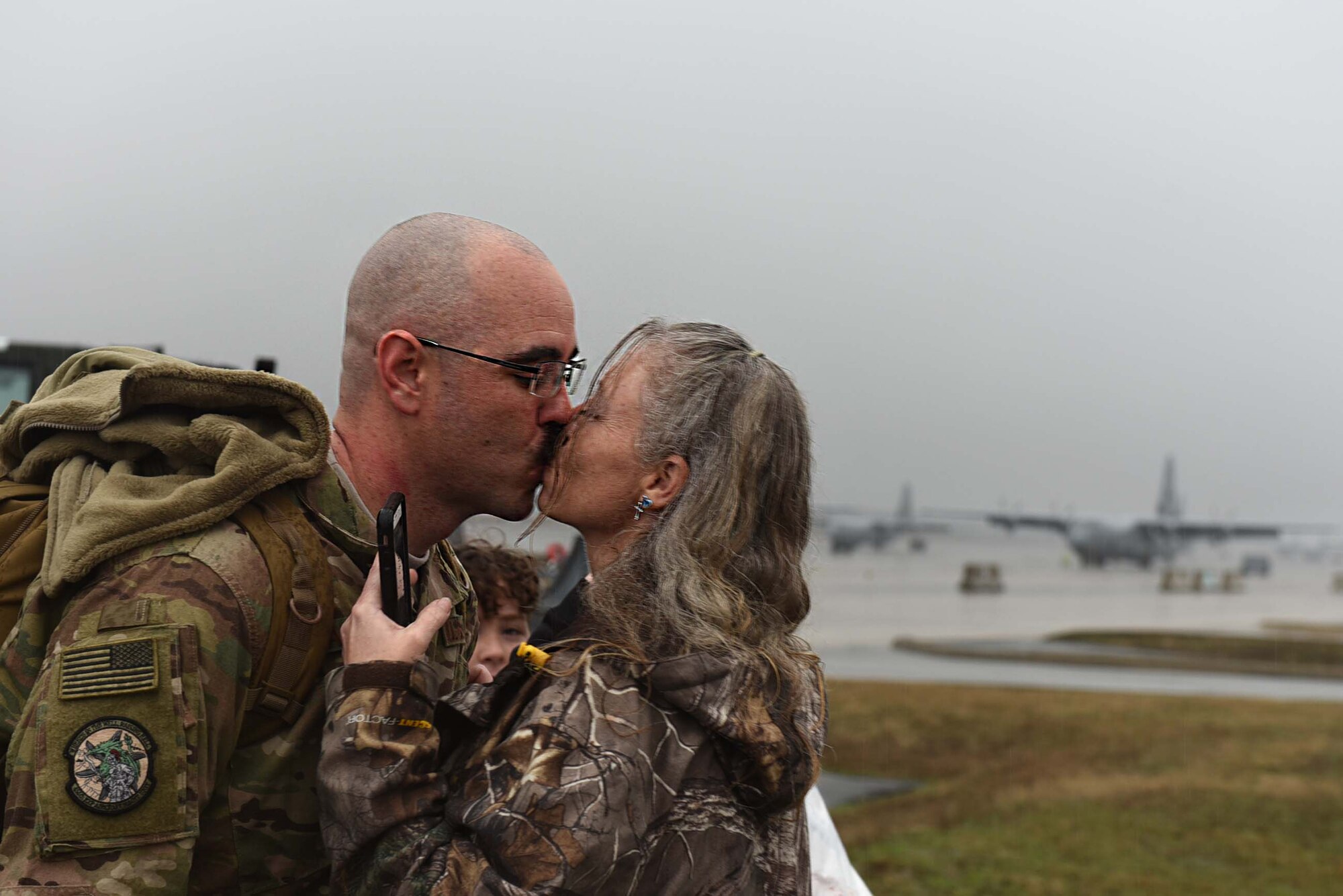 U.S. Air Force Tech. Sgt. Jason Caswell, 19th Aircraft Maintenance Squadron C-130J crew chief, reunites with his spouse after returning from a six-month deployment to Southwest Asia Jan 19, 2017, at Little Rock Air Force Base, Ark. Team Little Rock Airmen specialize in providing rapid, global mobility to support humanitarian and wartime operations.(U.S. Air Force photo by Airman 1st Class Kevin Sommer Giron)