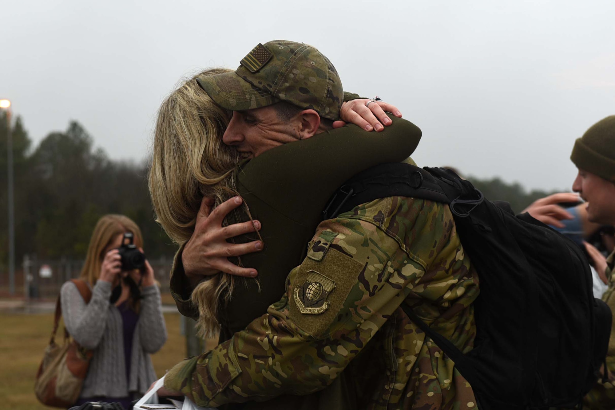 A U.S. Air Force Airman reunites with his wife after returning from a six-month deployment to Southwest Asia Jan 19, 2017, at Little Rock Air Force Base, Ark. Team Little Rock Airmen specialize in providing rapid, global mobility to support humanitarian and wartime operations.  (U.S. Air Force photo by Airman 1st Class Kevin Sommer Giron)