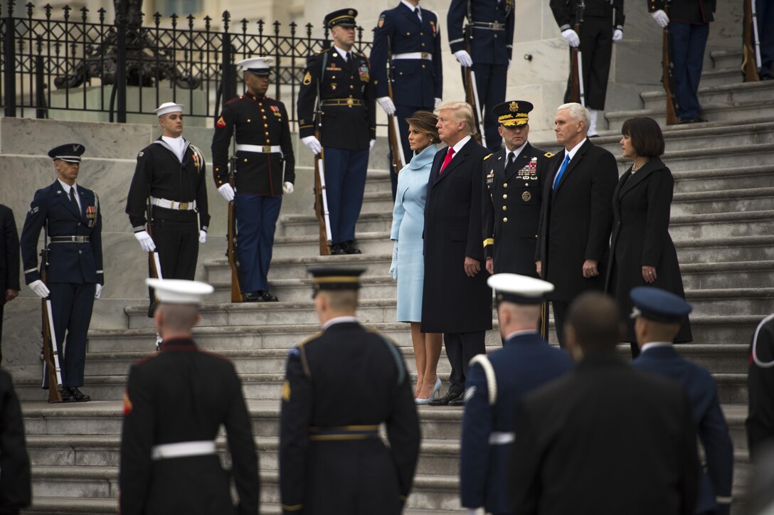 From center left, First Lady Melania Trump; President Donald J. Trump; Army Gen. Bradley A. Becker, commanding general of Joint Task Force National Capital Region; Vice President Michael R. Pence; and his wife, Karen, watch the pass in review of troops during the 58th presidential inauguration in Washington, D.C., Jan. 20, 2017. DoD photo by Air Force Staff Sgt. Marianique Santos