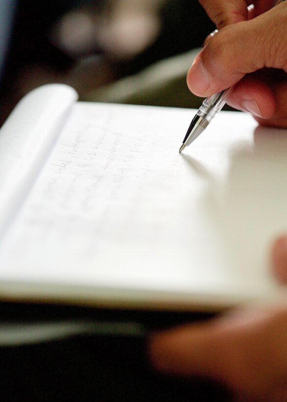 Philippines Air Force Tech. Sgt. Primitivio Cedi Jr., an aerial reconnaissance photographer, writes notes about the ground-based, satellite imagery system called Eagle Vision during an introductory briefing, Clark Air Base, Philippines, Jan. 16, 2017. Cedi is one of 15 Philippine Airmen participating in a two-week long Subject Matter Expert Exchange with the U.S. Air Force. Cedi and the other Filipinos will exchange ideas and experiences on how the two nations can use satellite imagery to enhance their combined Humanitarian Assistance and Disaster Relief capabilities. (U.S. Air Force photo by Tech. Sgt. James Stewart/Released)