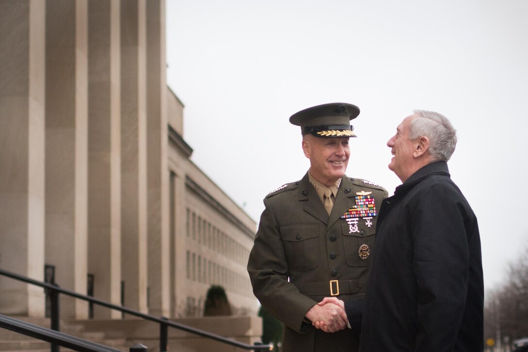 Defense Secretary Jim Mattis shares a light moment with Marine Corps Gen. Joe Dunford, chairman of the Joint Chiefs of Staff, upon arriving at the Pentagon for his first full day as secretary, Jan. 21, 2017. DoD photo by D. Myles Cullen