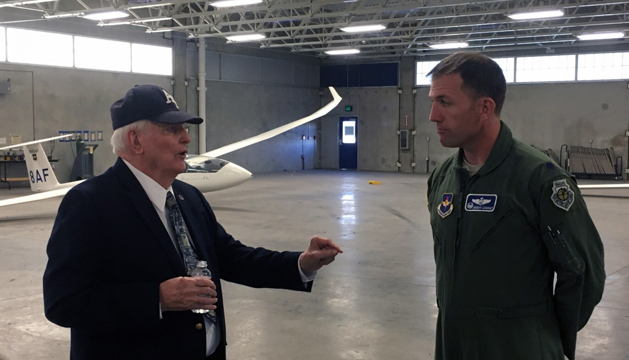 Retired Lt. Col. James Leland chats with Lt. Col. Jeremy Lushnat, commander of the 94th Flying Training Squadron, during his fall 2016 visit to the U.S. Air Force Academy. Leland assisted with the design of the airfield and the Academy's Airmanship Program the early 1960's. (Courtesy photo)