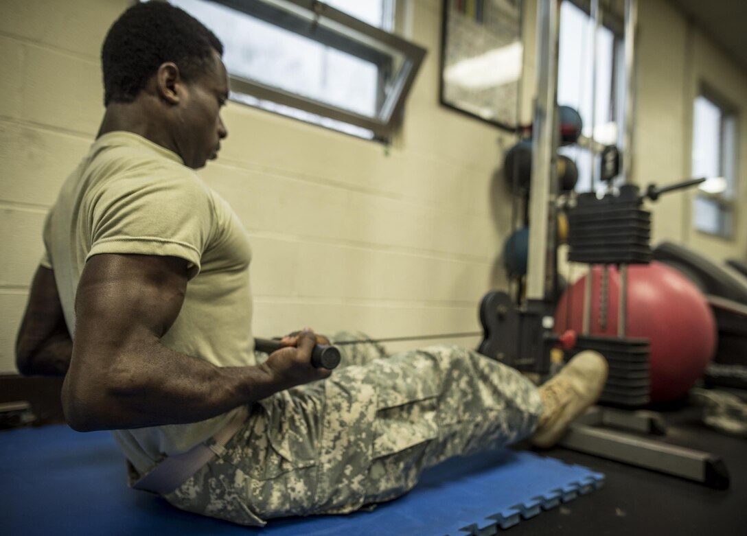 William Menso, a U.S. Army Reserve Private 1st Class from Norcross, Ga. with Charlie Company, 324th Expeditionary Signal Battalion, works out in the 335th Signal Command (Theater) headquarters building in East Point, Ga., Jan. 21, 2017. 