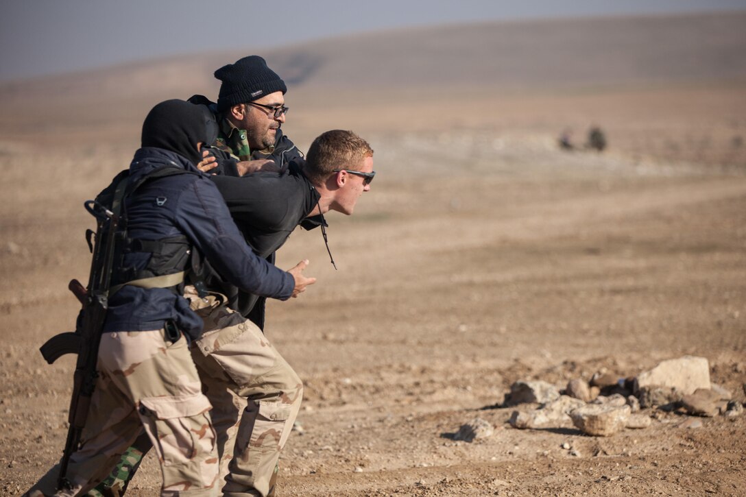 A Dutch trainer puts up a struggle when stopped and questioned during a simulated mobile checkpoint scenario at Black Tigers Training Camp, Iraq, Jan. 19, 2017. The Netherlands is one of over 60 coalition partners who are part of the Combined Joint Task Force – Operation Inherent Resolve building partner capacity mission dedicated to training Iraqi security forces.  CJTF-OIR is the global Coalition to defeat ISIL in Iraq and Syria. (U.S. Army photo by Sgt. Josephine Carlson)