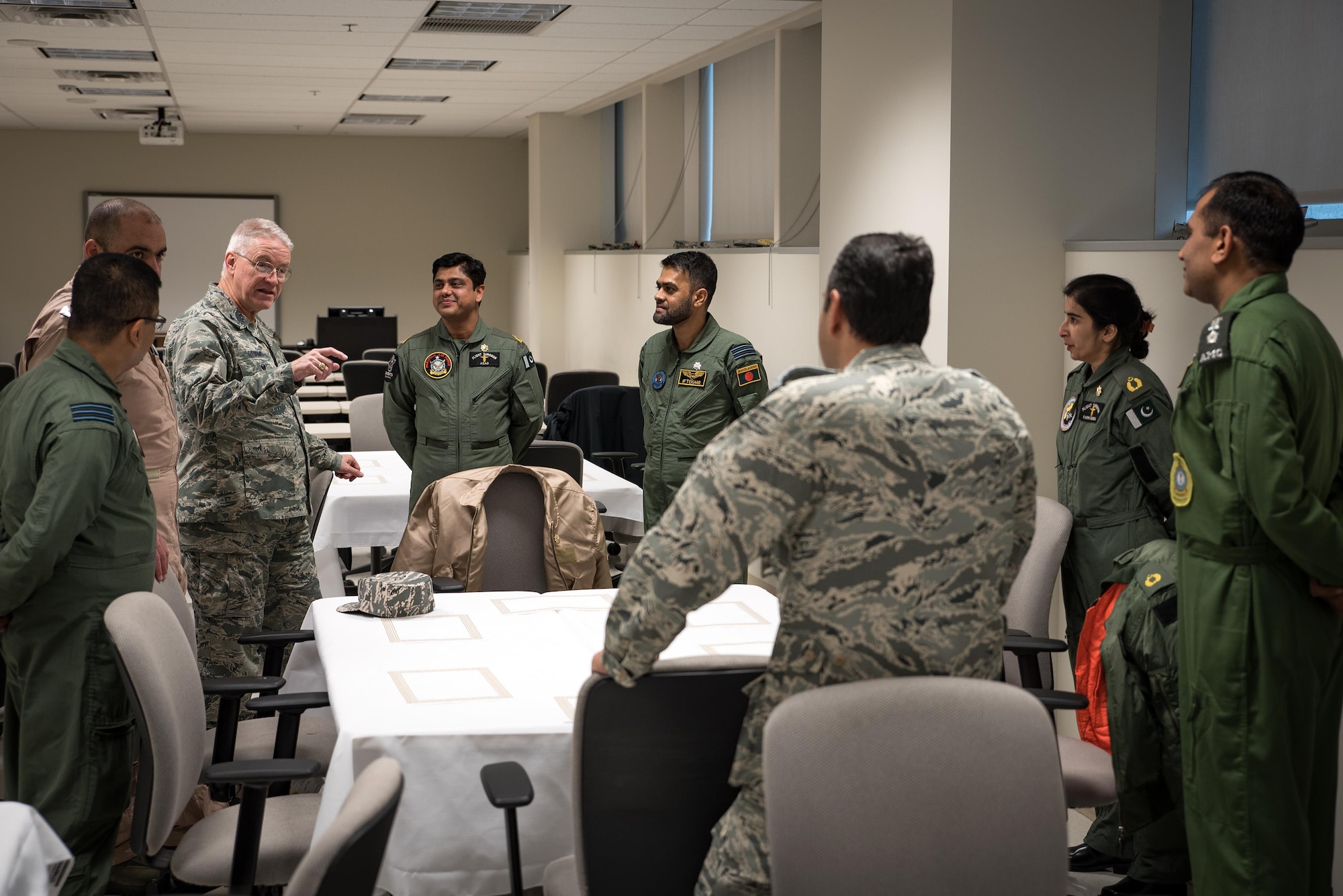 Col. Patrick Storms (third from left), Chair of the Aerospace Medicine Department at the United States Air Force School of Aerospace Medicine, talks with the students in this year's Advanced Aerospace Medicine for International Medical Officers course. The students spend 23 weeks at USAFSAM for the course. (U.S. Air Force photo/Rick Eldridge)