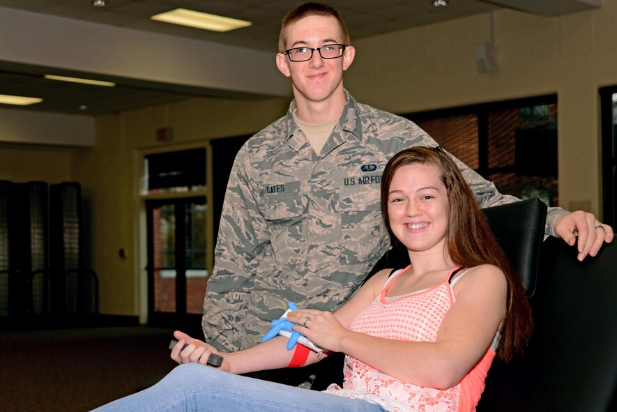 U.S. Air Force Airman Richard Cates, 20th Force Support Squadron fitness apprentice, left, and Tiffany Cates, his spouse, right, pose for a photo after donating blood at a blood drive at Shaw Air Force Base, S.C., Jan. 20, 2017. The Team Shaw members chose to donate together, resulting in the potential to save up to six lives. (U.S. Air Force photo by Airman 1st Class Kathryn R.C. Reaves)