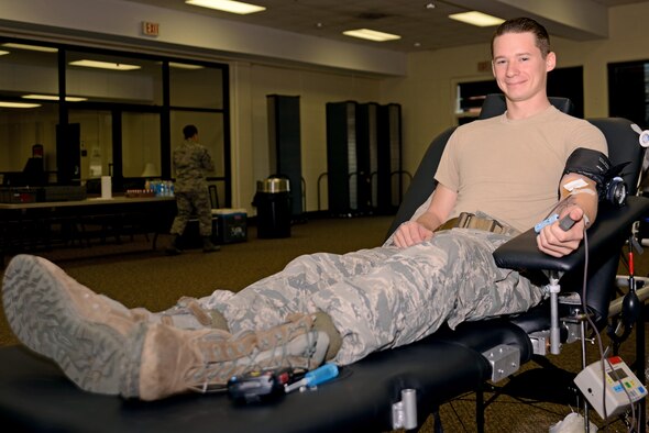 U.S. Air Force Senior Airman Mike Strickland, 20th Security Forces Squadron installation patrolman, sits on a donor bed while making his annual blood donation at a blood drive at Shaw Air Force Base, S.C., Jan. 20, 2017. Approximately 38 percent of the United States population is eligible to donate, but less than 10 percent give per year. (U.S. Air Force photo by Airman 1st Class Kathryn R.C. Reaves)